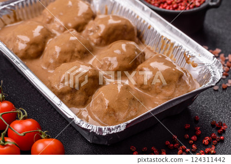 Meatballs with salt and spices in creamy caramel sauce Meatballs with salt and spices in creamy caramel sauce 124311442