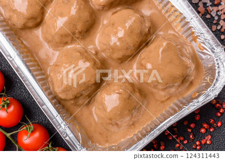 Meatballs with salt and spices in creamy caramel sauce Meatballs with salt and spices in creamy caramel sauce 124311443