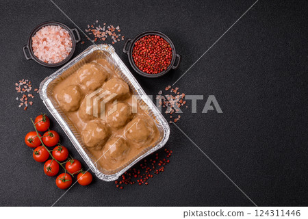 Meatballs with salt and spices in creamy caramel sauce Meatballs with salt and spices in creamy caramel sauce 124311446