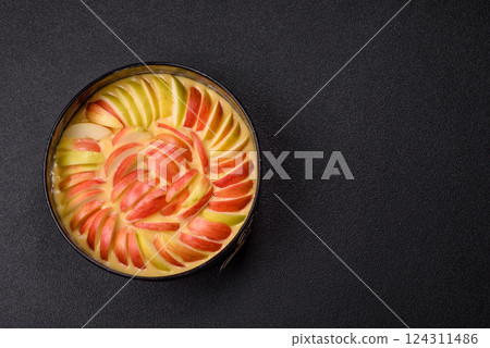 Raw sweet apple pie in a mold prepared for baking 124311486