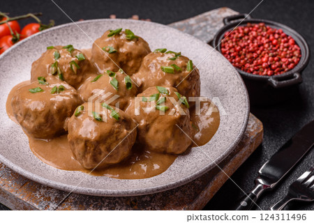 Meatballs with salt and spices in creamy caramel sauce Meatballs with salt and spices in creamy caramel sauce 124311496
