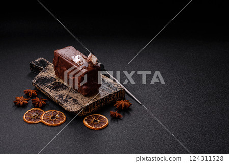 Piece of sweet chocolate bounty cake with coconut flakes and sponge 124311528