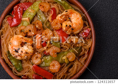 Glass noodles with shrimps and seafood, vegetables, spices and soy sauce Glass noodles with shrimps and seafood, vegetables, spices and soy sauce 124311657