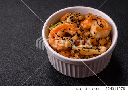 Rice with shrimps and seafood, vegetables, spices and soy sauce 124311678
