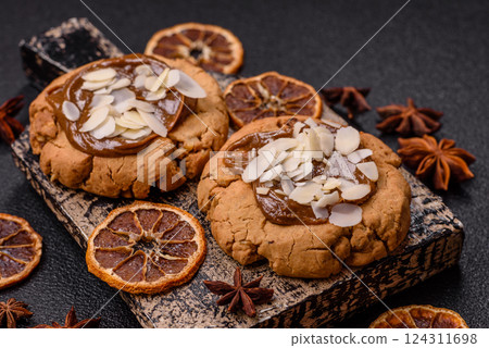 Round cookies with nuts and chocolate butter Round cookies with nuts and chocolate butter 124311698