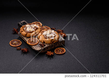 Round cookies with nuts and chocolate butter 124311701