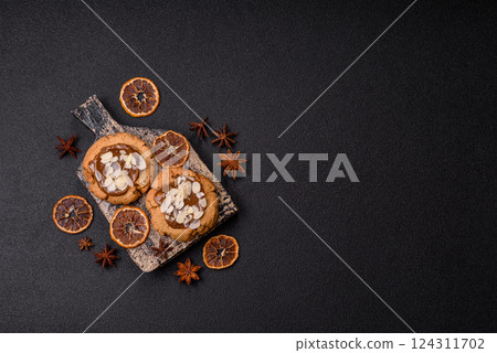 Round cookies with nuts and chocolate butter 124311702