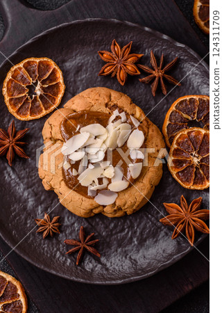 Round cookies with nuts and chocolate butter Round cookies with nuts and chocolate butter 124311709