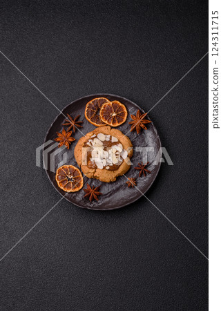 Round cookies with nuts and chocolate butter 124311715