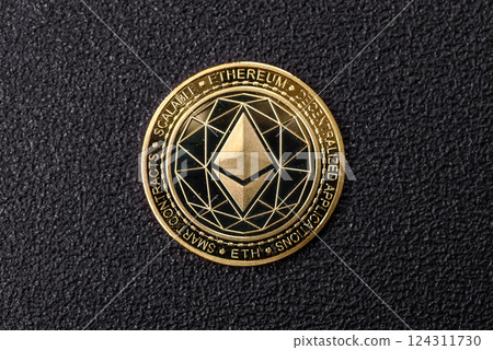 Ethereum cryptocurrency dummy in the form of a round iron coin 124311730