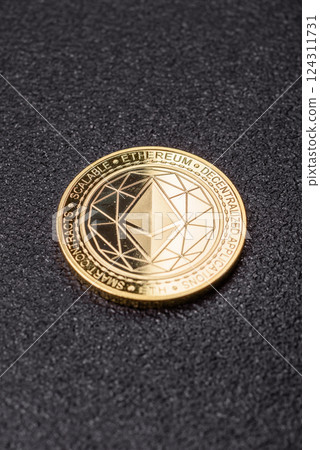 Ethereum cryptocurrency dummy in the form of a round iron coin 124311731