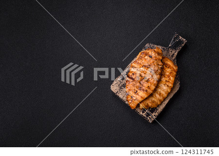 Delicious fresh grilled chicken fillet with spices and herbs 124311745