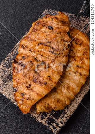 Delicious fresh grilled chicken fillet with spices and herbs 124311749