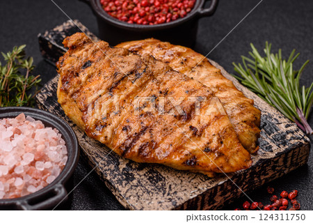 Delicious fresh grilled chicken fillet with spices and herbs 124311750