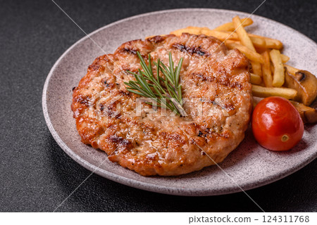 Delicious fresh grilled turkey fillet with spices and herbs Delicious fresh grilled turkey fillet with spices and herbs 124311768