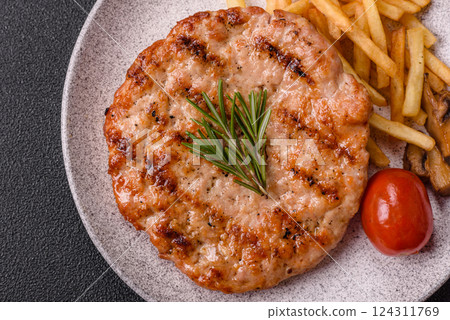 Delicious fresh grilled turkey fillet with spices and herbs Delicious fresh grilled turkey fillet with spices and herbs 124311769