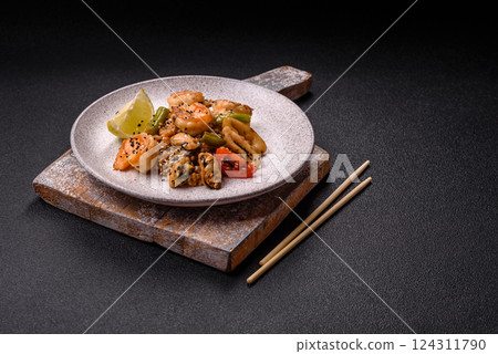 Rice with shrimps and seafood, vegetables, spices and soy sauce 124311790
