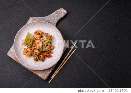 Rice with shrimps and seafood, vegetables, spices and soy sauce Rice with shrimps and seafood, vegetables, spices and soy sauce 124311791