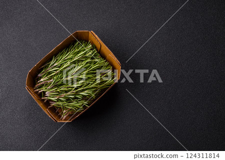 Fresh green rosemary sprigs prepared for cooking Fresh green rosemary sprigs prepared for cooking 124311814