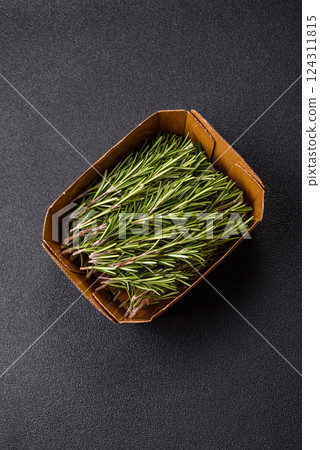 Fresh green rosemary sprigs prepared for cooking Fresh green rosemary sprigs prepared for cooking 124311815