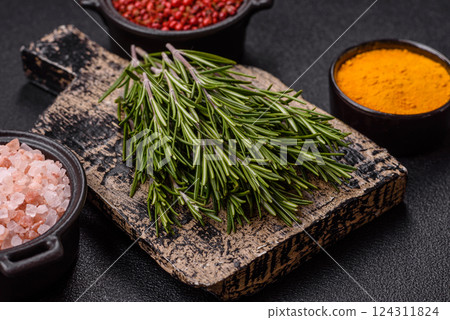 Fresh green rosemary sprigs prepared for cooking Fresh green rosemary sprigs prepared for cooking 124311824