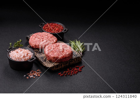 Fresh raw ground beef burger patty with salt and spices Fresh raw ground beef burger patty with salt and spices 124311840