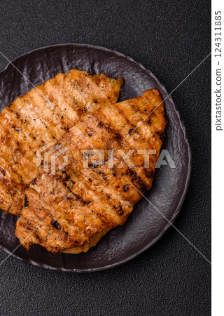 Delicious fresh grilled chicken fillet with spices and herbs 124311885