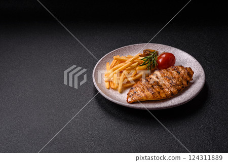Delicious fresh grilled chicken fillet with spices and herbs Delicious fresh grilled chicken fillet with spices and herbs 124311889