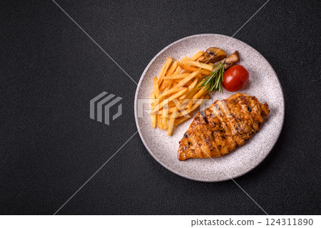 Delicious fresh grilled chicken fillet with spices and herbs Delicious fresh grilled chicken fillet with spices and herbs 124311890