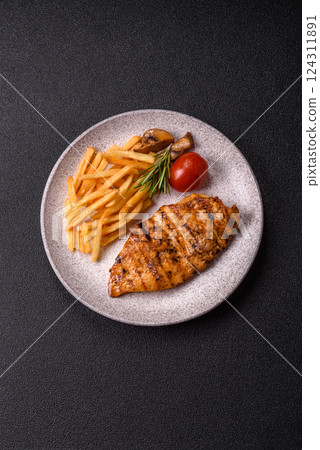 Delicious fresh grilled chicken fillet with spices and herbs 124311891