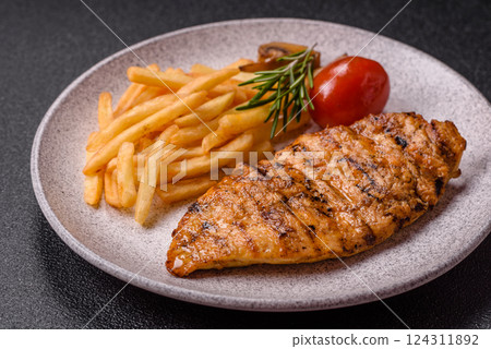 Delicious fresh grilled chicken fillet with spices and herbs 124311892