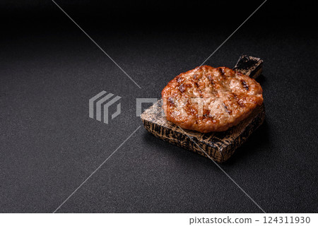 Delicious fresh grilled turkey fillet with spices and herbs Delicious fresh grilled turkey fillet with spices and herbs 124311930