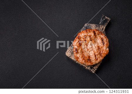 Delicious fresh grilled turkey fillet with spices and herbs Delicious fresh grilled turkey fillet with spices and herbs 124311931