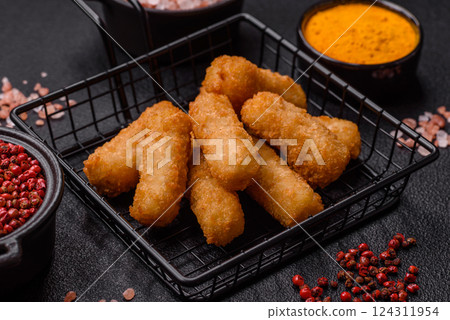 Delicious crispy cheese sticks with mozzarella, salt and spices Delicious crispy cheese sticks with mozzarella, salt and spices 124311954