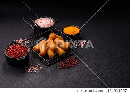 Delicious crispy cheese sticks with mozzarella, salt and spices 124311957