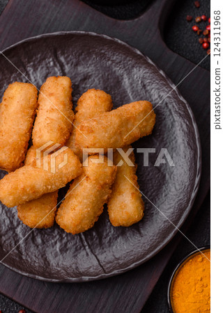 Delicious crispy cheese sticks with mozzarella, salt and spices 124311968