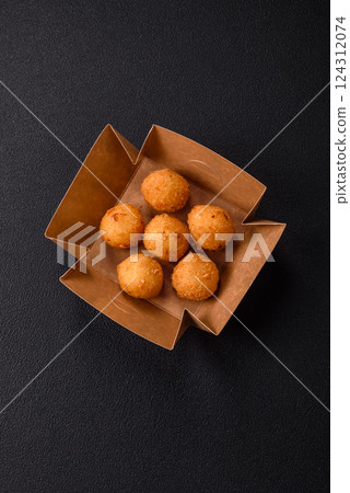 Crispy French fries with mozzarella cheese with raspberry sauce 124312074