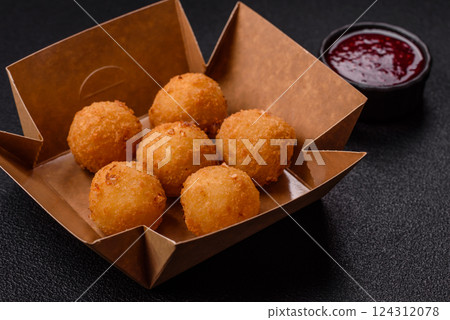 Crispy French fries with mozzarella cheese with raspberry sauce Crispy French fries with mozzarella cheese with raspberry sauce 124312078