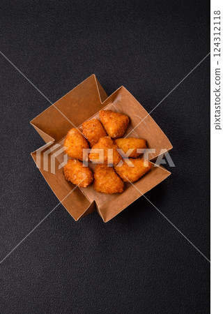 Brie cheese or camembert fries in breading, fast food, takeaway Brie cheese or camembert fries in breading, fast food, takeaway 124312118