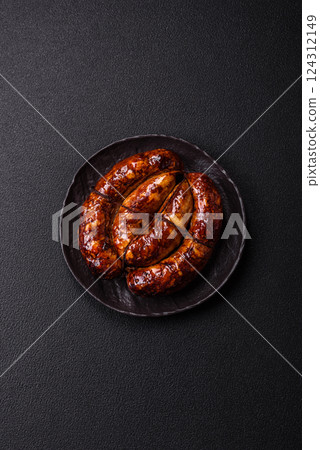 Delicious sausage with salt, spices and herbs Delicious sausage with salt, spices and herbs 124312149