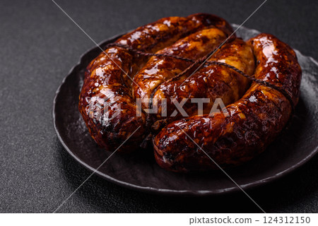 Delicious sausage with salt, spices and herbs Delicious sausage with salt, spices and herbs 124312150