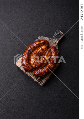 Delicious sausage with salt, spices and herbs Delicious sausage with salt, spices and herbs 124312161