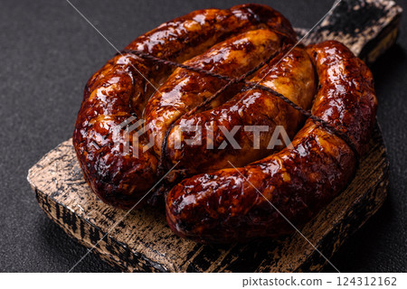 Delicious sausage with salt, spices and herbs Delicious sausage with salt, spices and herbs 124312162