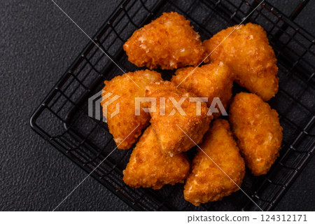 Brie cheese or camembert fries in breading, fast food, takeaway 124312171