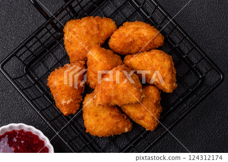 Brie cheese or camembert fries in breading, fast food, takeaway Brie cheese or camembert fries in breading, fast food, takeaway 124312174