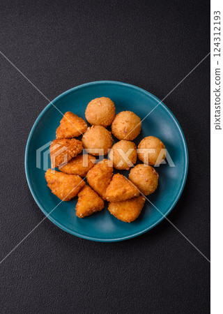 Brie cheese or camembert fries in breading, fast food, takeaway Brie cheese or camembert fries in breading, fast food, takeaway 124312193