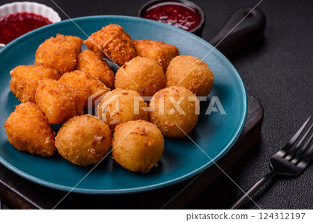 Brie cheese or camembert fries in breading, fast food, takeaway Brie cheese or camembert fries in breading, fast food, takeaway 124312197