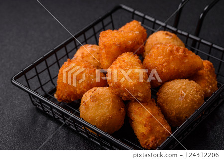 Brie cheese or camembert fries in breading, fast food, takeaway 124312206