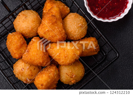 Brie cheese or camembert fries in breading, fast food, takeaway Brie cheese or camembert fries in breading, fast food, takeaway 124312210