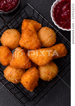 Brie cheese or camembert fries in breading, fast food, takeaway 124312211